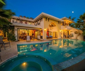 Ocean-view Flamingo Palace with stone courtyard and giant infinity pool