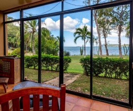 Warm interiors and orange hues on ground floor in front of beach in Flamingo
